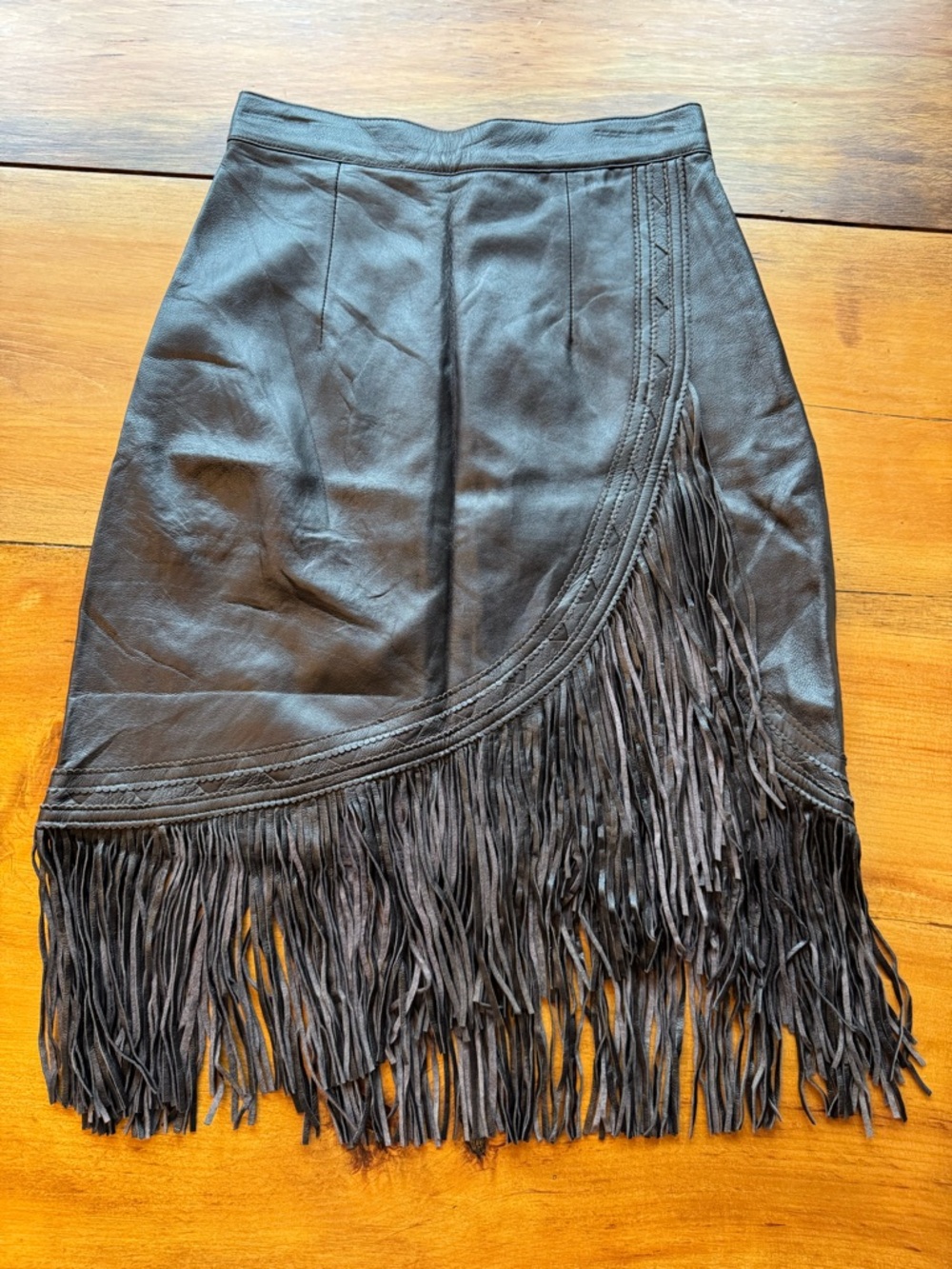 Vintage chocolate brown fringe leather skirt. Size 24